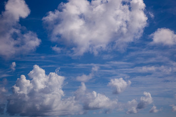 Naklejka na ściany i meble White fluffy clouds with a beautiful blue sky