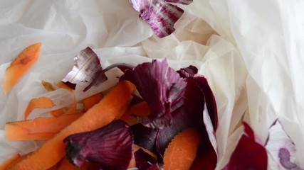 timelapse stop motion, white biodegradable bag being filed buy organic waste