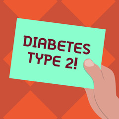 Handwriting text writing Diabetes Type 2. Concept meaning condition which body does not use insulin properly Drawn Hu analysis Hand Holding Presenting Blank Color Paper Cardboard photo