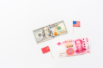 Creative top view flat lay of USA and China flags and cash money, mockup and copy space on white background in minimal style. Concept of trade war between USA and China
