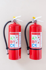 Fire extinguisher system on the wall background, powerful emergency equipment for industrial