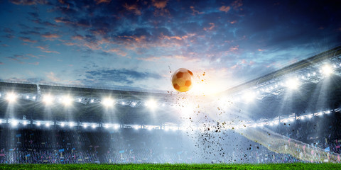 Football stadium background with flying ball