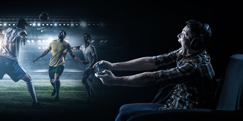 Young man playing football video game