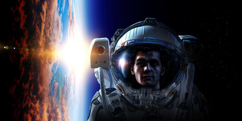 Fototapeta premium Spaceman and planet, human in space concept