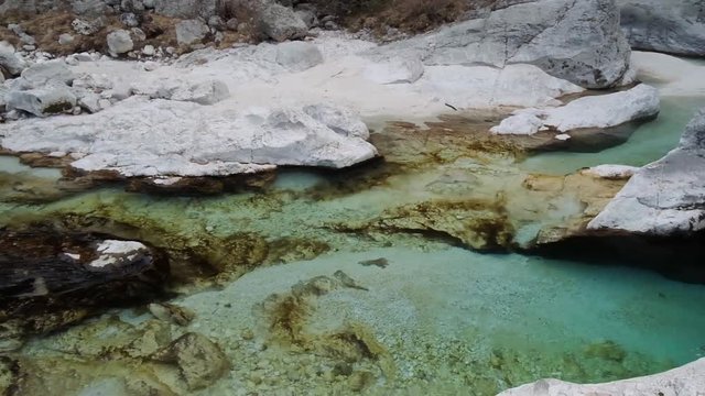 Beautiful view of turquoise water going down the river at Soca river, Slovenia.