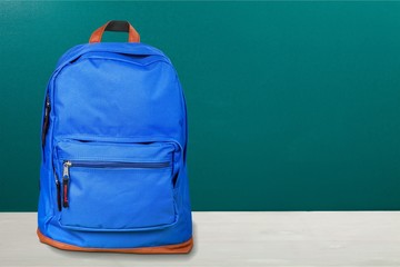 Blue school bag on background