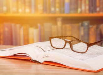Stack of Ancient books on library background