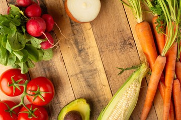 Frame with fresh vegetables. On wooden background. Veggie set.flat lay. Harvesting. Gastronomy