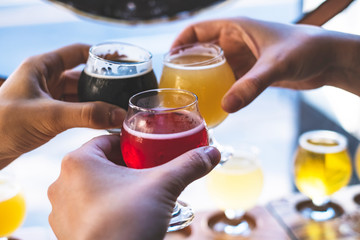 Friends toasting with beer