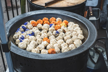 Chinese dumplings cooking in a . pan