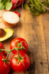 Fresh vegetables on wooden background. Top view. Vertical photo. Vegetarian sets. Harvest. Gastronomy