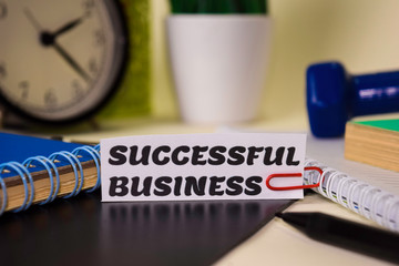 Obraz premium Successfull Business on the paper isolated on it desk. Business and inspiration concept