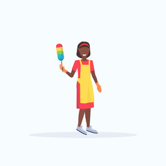 smiling housewife holding dust brush african american woman cleaner dusting cleaning service housework concept full length flat white background