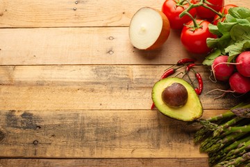 Fresh set of vegetables on a wooden background with space. Colorful background. Vegetarian sets. Harvest. Gastronomy