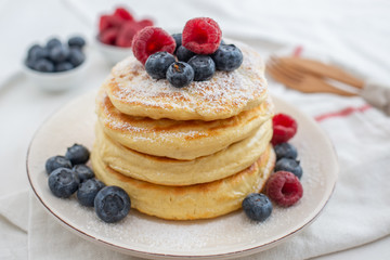 home made sweet pancakes with berries for breakfast