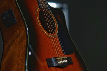 Obraz premium acoustic guitar on black background