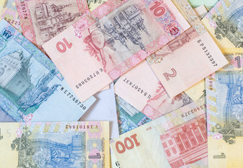 Hryvnia paper bill. Notes in denominations of one, two, five, ten, twenty, fifty and one hundred hryvna. Uah. Cash. Background texture. Ukrainian money.