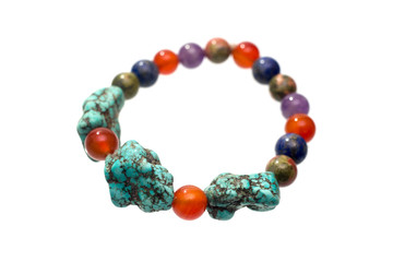 Turquoise, Unakite, lapis lazuli, Carnelian and Amethyst  bracelet isolated on white background.