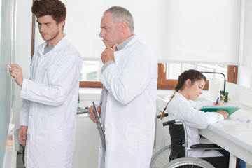 Fototapeta premium student working formula with teacher