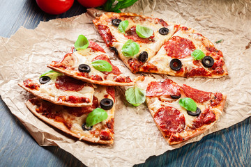 Slices of pizza pepperoni with olives