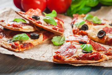 Slices of pizza pepperoni with olives