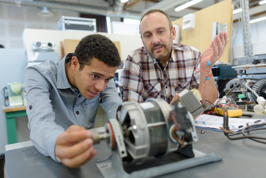 scientist controlling a robot