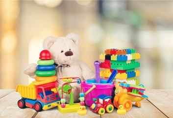 Toys collection on wooden table with blurred background