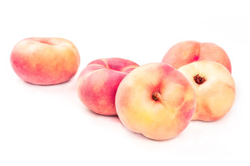 Vibrant organic flat saturn peaches on a white background with a place for text