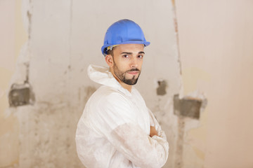 portrait of confident mid adult manual worker with arms crossed