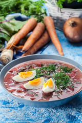 Beetroot soup served with boiled egg