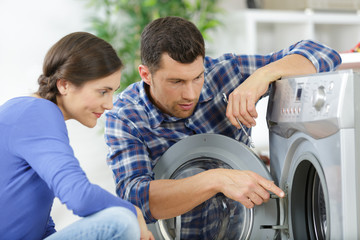 couple at groceries store buy washing machine