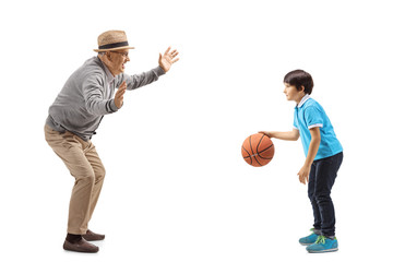 Grandfather playing basketball with his grandson
