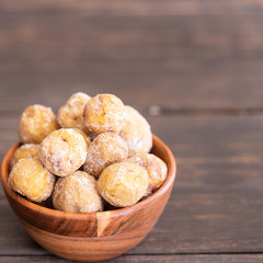 Popular Canary Islands dish, Papas Arrugadas (wrinkly potatoes with salt)  on wooden background with copy space.