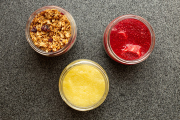 Ice cold sweet green lime tea drink on the wooden table with outdoor sun lighting with ice cubes and splashes of drink