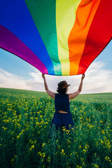 Gay Rainbow Flag on a green meadow outdoors