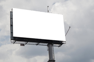 blank billboard on background of blue sky with clouds