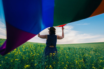 Gay Rainbow Flag on a green meadow outdoors