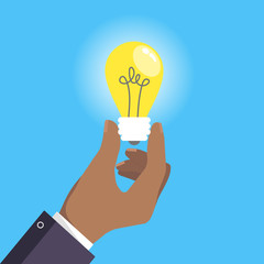 Hand holds lightbulb icon sign flat style design vector illustration isolated on white background. Idea symbol concept.