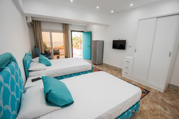 Twin beds in a luxury apartment with sea view