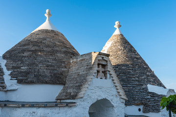 Trulli of the Itria valley. Details in the sky. Puglia, Italy.