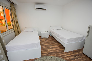 Twin beds in a luxury apartment with sea view