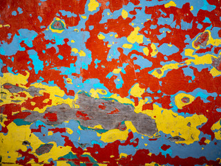 Color cracks,red,yellow,green,blue. Abstract art background. Old oil paint on the wooden floor. Scratch paint