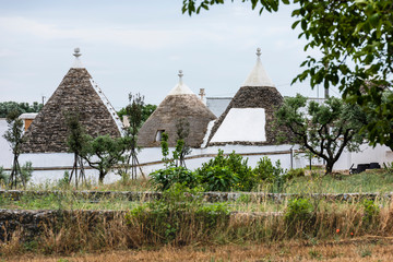 Trulli of the Itria valley. Details in the sky. Puglia, Italy.