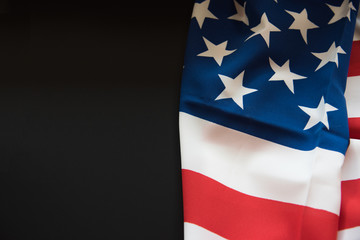 American flag close up in dark background with copy space