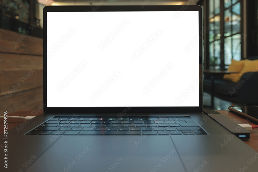 Poster laptop computer on wooden desk in cafe. monitor file contains clipping path can use add text and vid