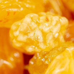 Yellow raisins as background