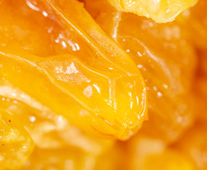 Fototapeta na wymiar Yellow raisins as background