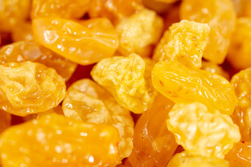 Yellow raisins as background