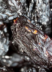 Black dry raisins as background