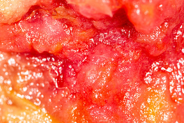 Red fruit jam as abstract background